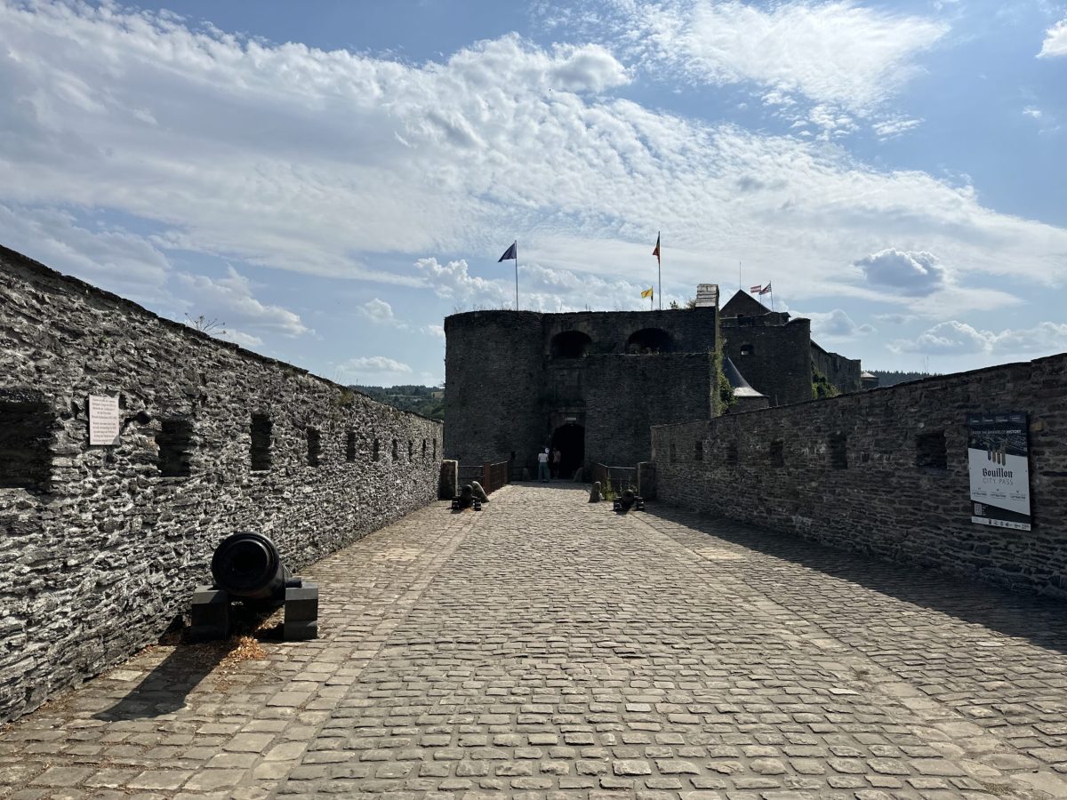 Stone gateway and courtyard of Bouillon Castle with medieval fortress architecture