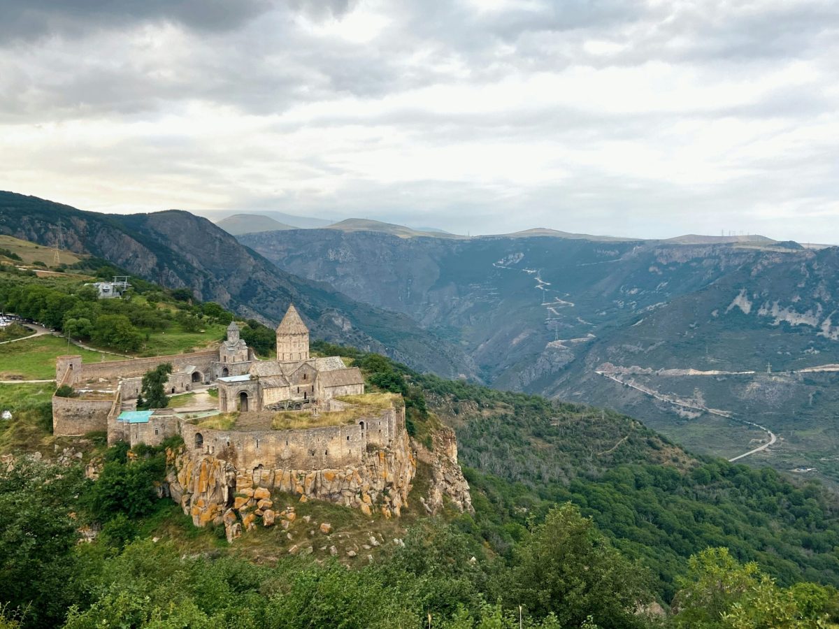 Tatev Monastery perched on a cliff overlooking the lush Syunik valley in Armenia