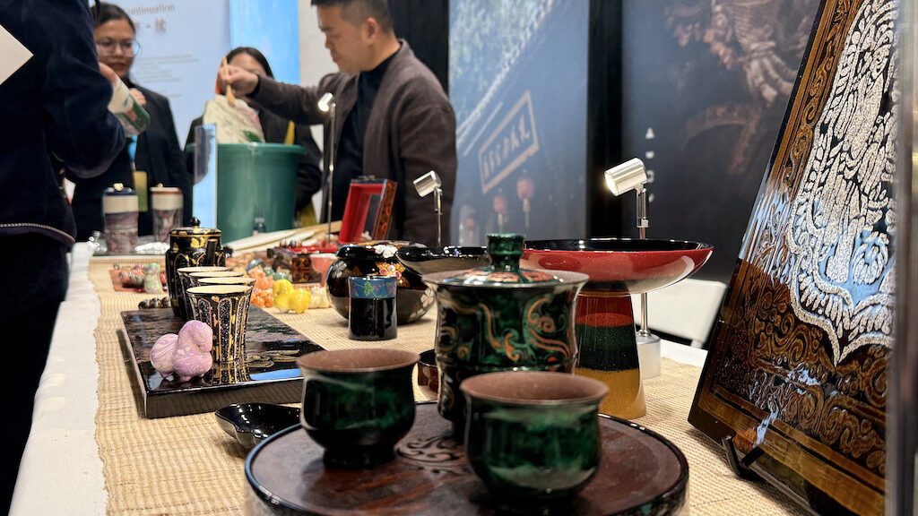 Traditional Chinese tea set and cultural artifacts displayed at Zhejiang tourism exhibition in Brussels