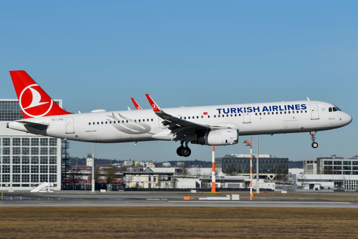 Turkish Airlines Airbus A321 landing with Istanbul cityscape in background