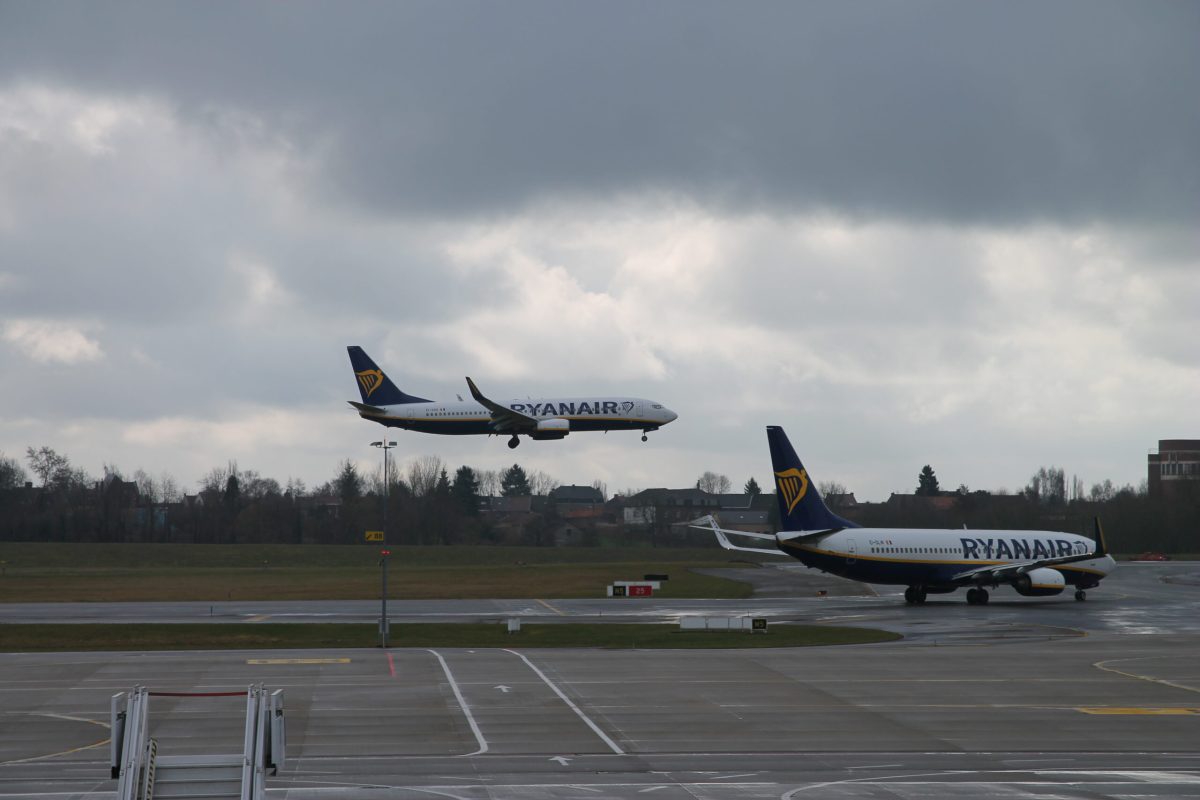 Two Ryanair aircraft on Charleroi Airport's runway during daytime operations