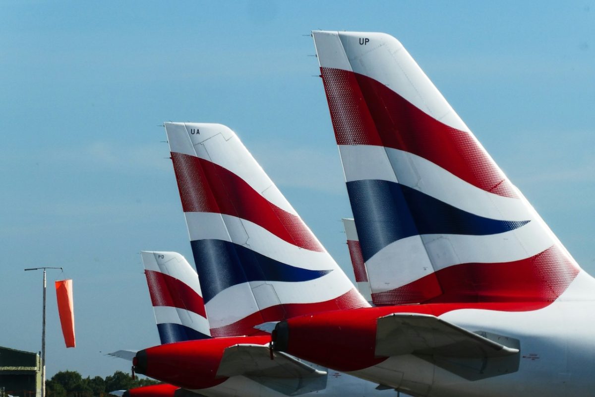 British Airways aircraft tail fins showing red, white and blue livery against blue sky