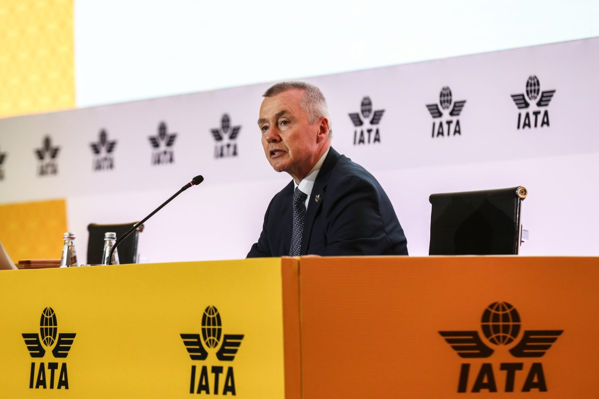 Willie Walsh, IATA chief, speaking at podium with IATA logos visible